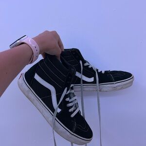 Black and white high top vans